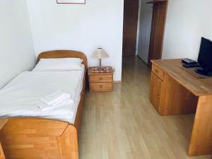 Posteľ alebo postele v izbe v ubytovaní Stiftstaverne Klein Mariazell