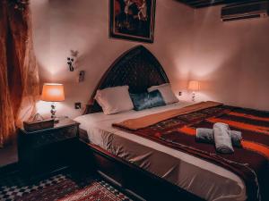 Postel nebo postele na pokoji v ubytování Riad Pacha Palace