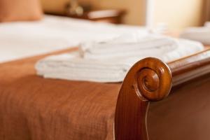 A bed or beds in a room at SGE Esplanade Hotel