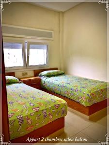 Llit o llits en una habitació de Hôtel Réstinga Martil