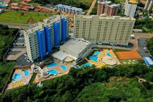 an aerial view of a resort with a pool and buildings at Golden Dolphin Grand Hotel in Caldas Novas