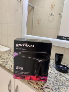 a box sitting on a counter in a bathroom at 205- Apartamento 1 quarto suite, Encantador, amplo e decorado, mobiliario moderno, cozinha completa com utensílios , Excelente vista da cidade e localização privelegiada no bairro Bigorrilho , in Curitiba +43 photos