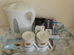 a kitchen counter with a blender and measuring cups at Bay Court in Bridlington
