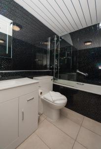 A bathroom at SGE Esplanade Hotel