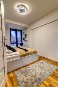 Posteľ alebo postele v izbe v ubytovaní Apartament Gwiazda Perła Krynicy