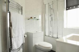 A bathroom at SGE Esplanade Hotel