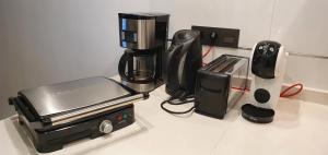 a counter top with a coffee maker and a blender at Oasis Beach in Orihuela