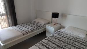 A bed or beds in a room at Casa Rincón Medanero Még 19 kép