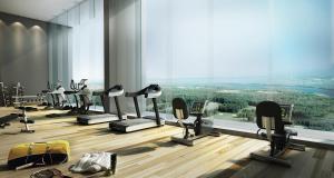 a gym with a large window with tread machines at HOMESTAY D'Univ 360 PLACE in Seri Kembangan