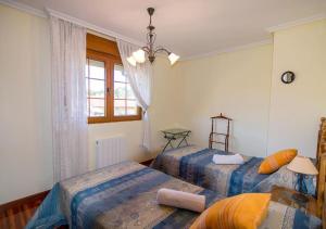 Postel nebo postele na pokoji v ubytování Villa Miguel