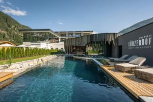 The swimming pool at or close to Alpin Life Resort Lürzerhof