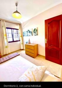 Postel nebo postele na pokoji v ubytování Villa Ágatha, vacaciones en familia en Lanzarote