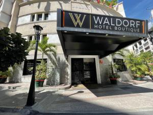 a hotel building with a sign that reads waldorfventory at Waldorf Hotel in Caracas