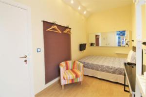 מיטה או מיטות בחדר ב-Hostal Arco Iris