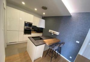 Kuchyň nebo kuchyňský kout v ubytování Style Apartment
