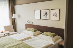 Llit o llits en una habitació de Hotel Split