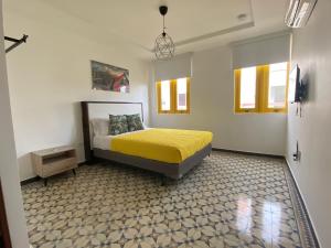 Postel nebo postele na pokoji v ubytování Hotel Nest