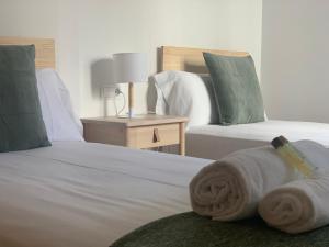 A bed or beds in a room at OKTHEWAY Castelao Street