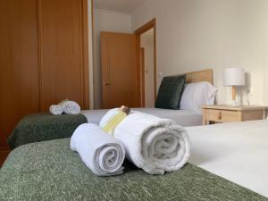 A bed or beds in a room at OKTHEWAY Castelao Street