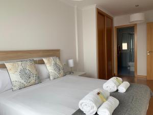 A bed or beds in a room at OKTHEWAY Castelao Street