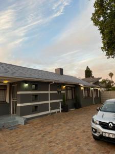 a house with a car parked in front of it at Hirondelle @ 45 Old Paarl in Bellville
