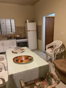 Η κουζίνα ή μικρή κουζίνα στο Casa de veraneio perto do mar +12 φωτογραφίες