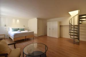 a bedroom with a bed and a glass table at Luxury Battisti in Padova