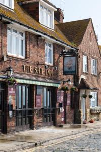 a brick building with a sign that reads the ship inn at The Ship Inn Folkestone in Folkestone
