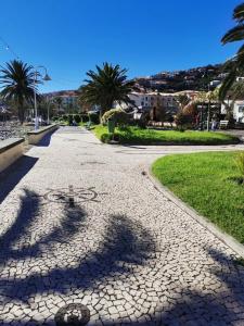 a cobblestone street with a bicycle on it at Casa de Férias Morena Santa Cruz Madeira in Santa Cruz