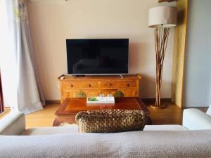 Uma televisão e/ou sistema de entretenimento em Suite totalement équipée avec vue imprenable!!!!