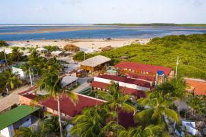 an aerial view of a resort and a beach at Paraíso dos Ventos in Atins