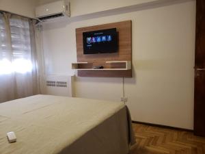 מיטה או מיטות בחדר ב-Departamento de Antonia