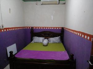 Postel nebo postele na pokoji v ubytování Hotel Alifah 1 Syariah