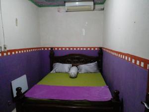 Postel nebo postele na pokoji v ubytování Hotel Alifah 1 Syariah