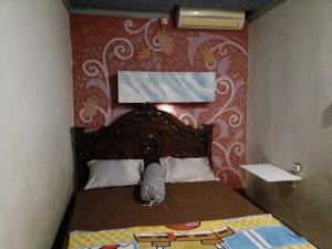 Postel nebo postele na pokoji v ubytování Hotel Alifah 1 Syariah