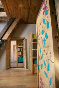 a room with bunk beds and a wall with butterflies at The Coffee Bean Hostel in San Cristóbal de Las Casas