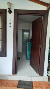 an open door of a house with a hallway at MJM Villa in Colombo
