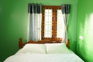 A bed or beds in a room at SSK HOME STAY