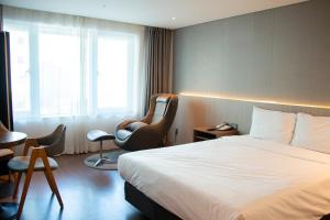 Posezení v ubytování The First70 Hotel