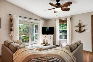 a living room with a couch and a tv at Vacation Vibes in Marathon