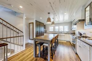 a large kitchen with a wooden table and chairs at Sandpiper 95096 in Fernandina Beach