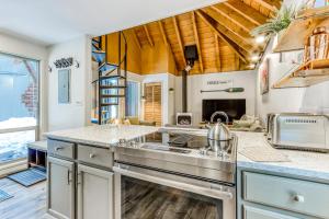 a kitchen with a sink and a stove top oven at 18 Antelope in Sunriver