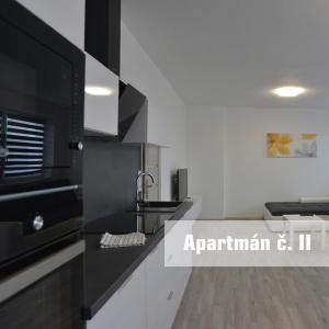 Kuchyň nebo kuchyňský kout v ubytování Apartmány U koupaliště