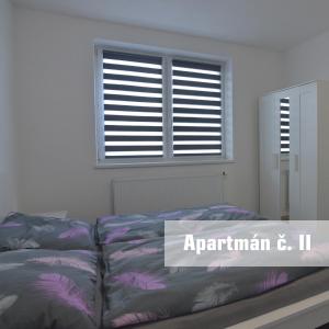Postel nebo postele na pokoji v ubytování Apartmány U koupaliště