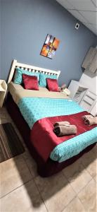a bedroom with a large bed in a room at Tri M Waves Lodge in Ponta do Ouro