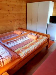 a bed with two towels on it in a room at SočaLand Glamping in Bovec
