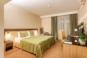 Posteľ alebo postele v izbe v ubytovaní Hotel Tami Residence