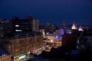 a view of a city at night with lights at Pioneer Luxe Hotel in Saratov