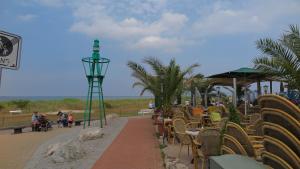 a row of chairs and tables on the beach at Ferienwohnung Nordsee in Cuxhaven
