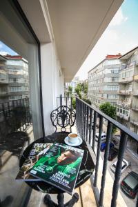 a balcony with a table with a magazine on it at Great Fortune Design Hotel & Spa in Istanbul